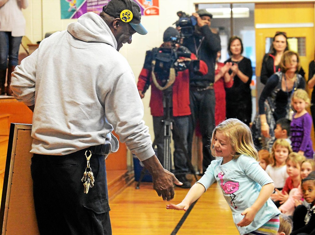"African-American hero" Percy Herder gets a high-five from a student as he leaves the assembly at Thomas Fitzwater Elementary School Feb 19, 2016. Bob Raines - Digital First Media